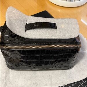 BNWOT Elegant Black Crocodile-Embossed Women's toiletry bag.